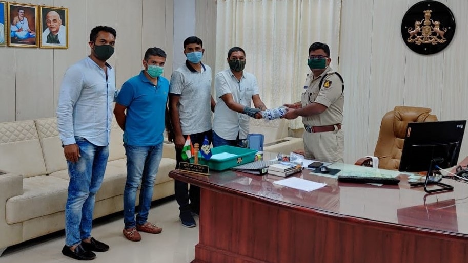 Distribution of protective face masks with RTI Logo