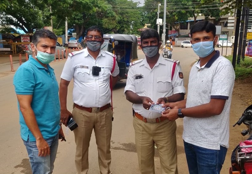 Distribution of protective face masks with RTI Logo