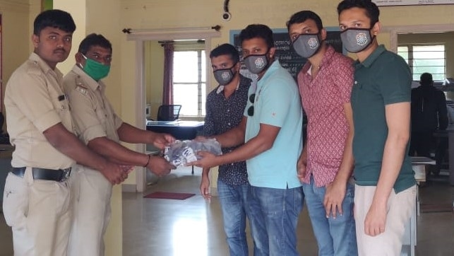 Distribution of protective face masks with RTI Logo